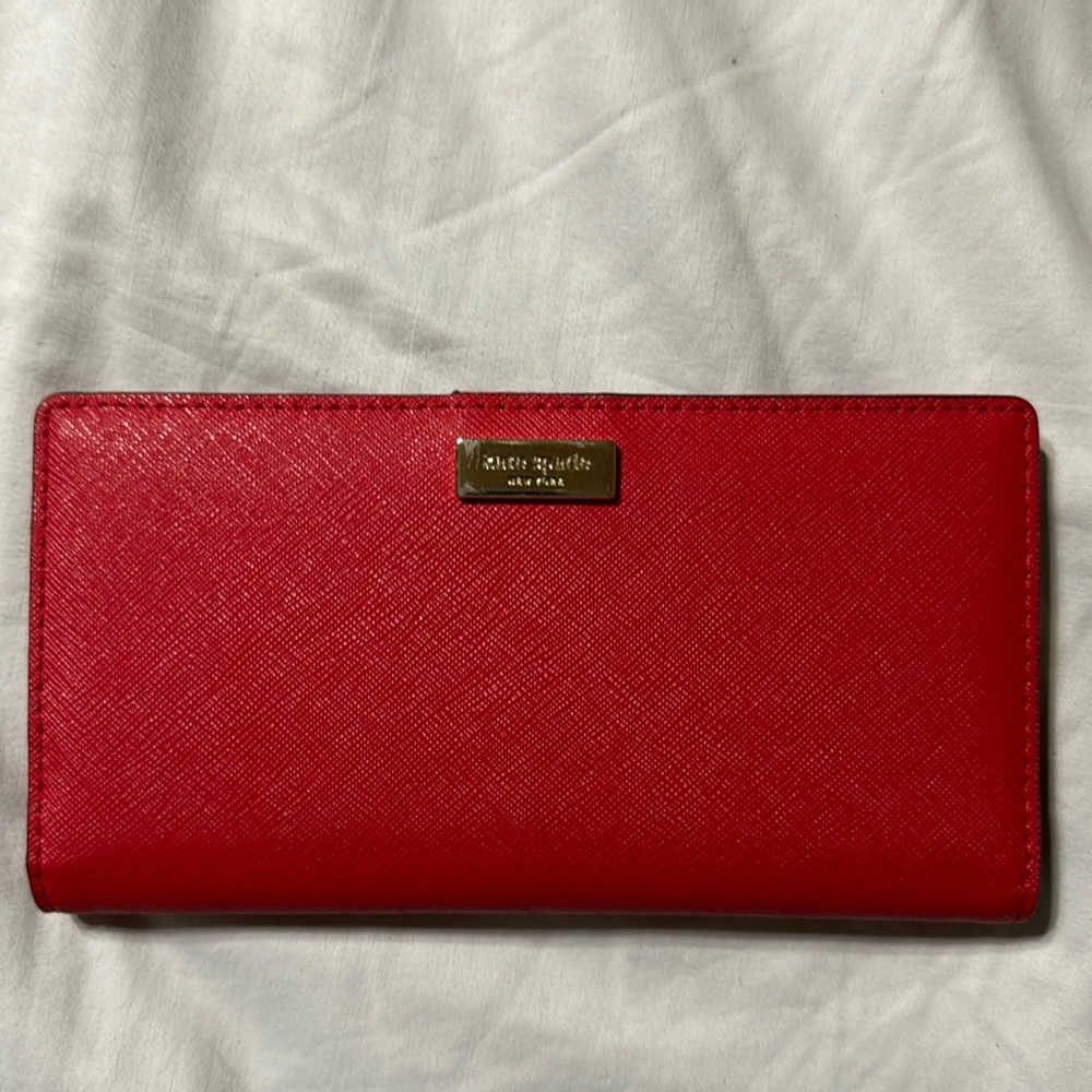 Kate Spade Saffiano large slim bifold wallet red coral EUC